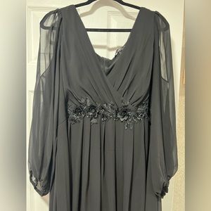 Beautiful black evening gown. Long sleeve with slits on sides